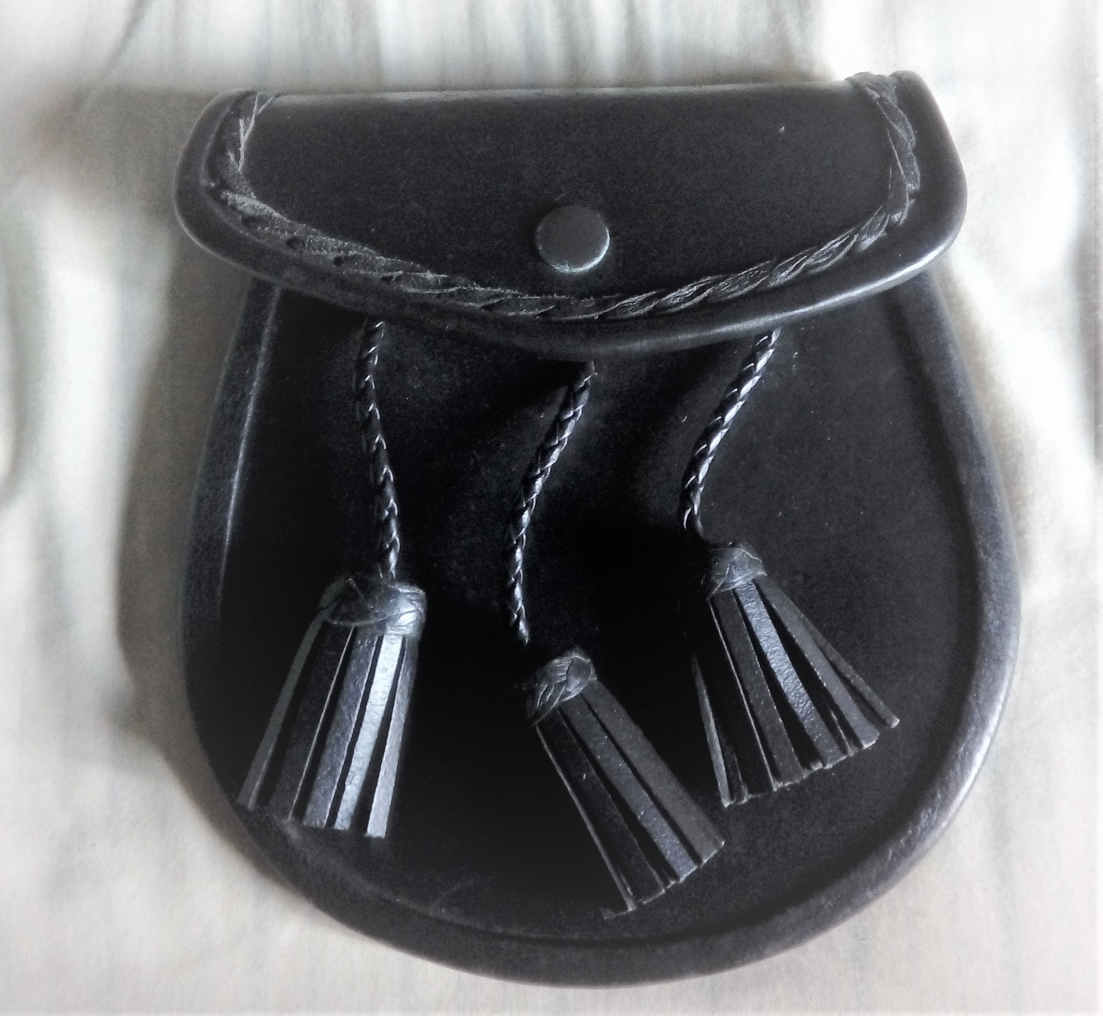 Black Leather Sporran with Tassels. Press stud closure to flap-New and unused